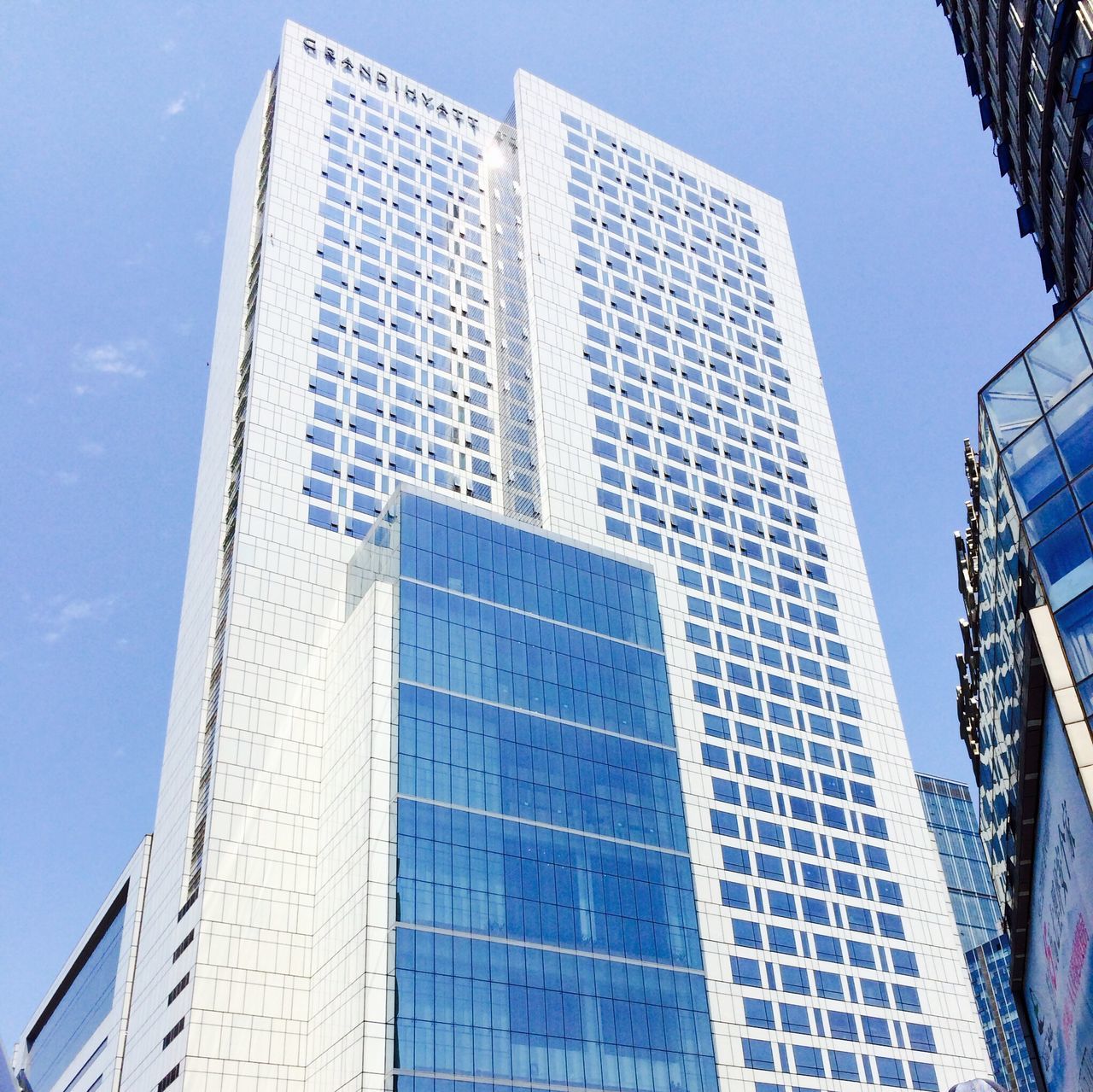 building exterior, architecture, low angle view, built structure, office building, modern, city, skyscraper, tall - high, building, reflection, tower, blue, glass - material, sky, day, window, outdoors, no people, tall