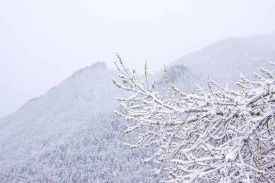 Scenic view of snow covered mountain against clear sky