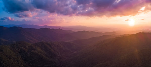 Scenic view of mountains against sky during sunset