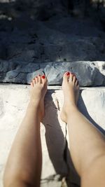 Low section of woman relaxing outdoors