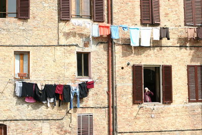 Clothesline by window old building