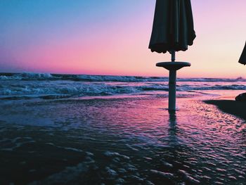 Scenic view of sea against clear sky during sunset