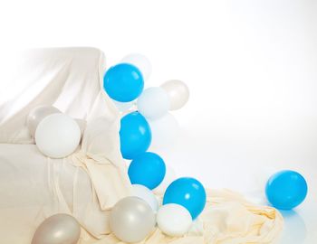 High angle view of balloons against white background