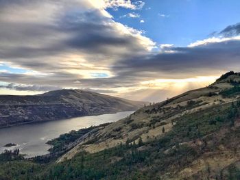 Scenic view of mountains against sky during sunset