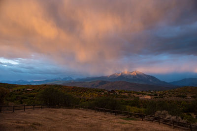 Scenic view of landscape and mountains against sky