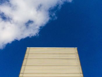 Low angle view of building against blue sky