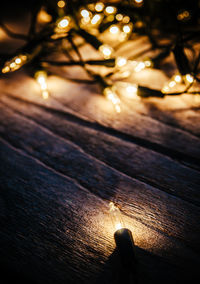 High angle view of illuminated string lights on table during christmas