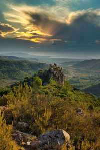 Scenic view of landscape against sky during sunset