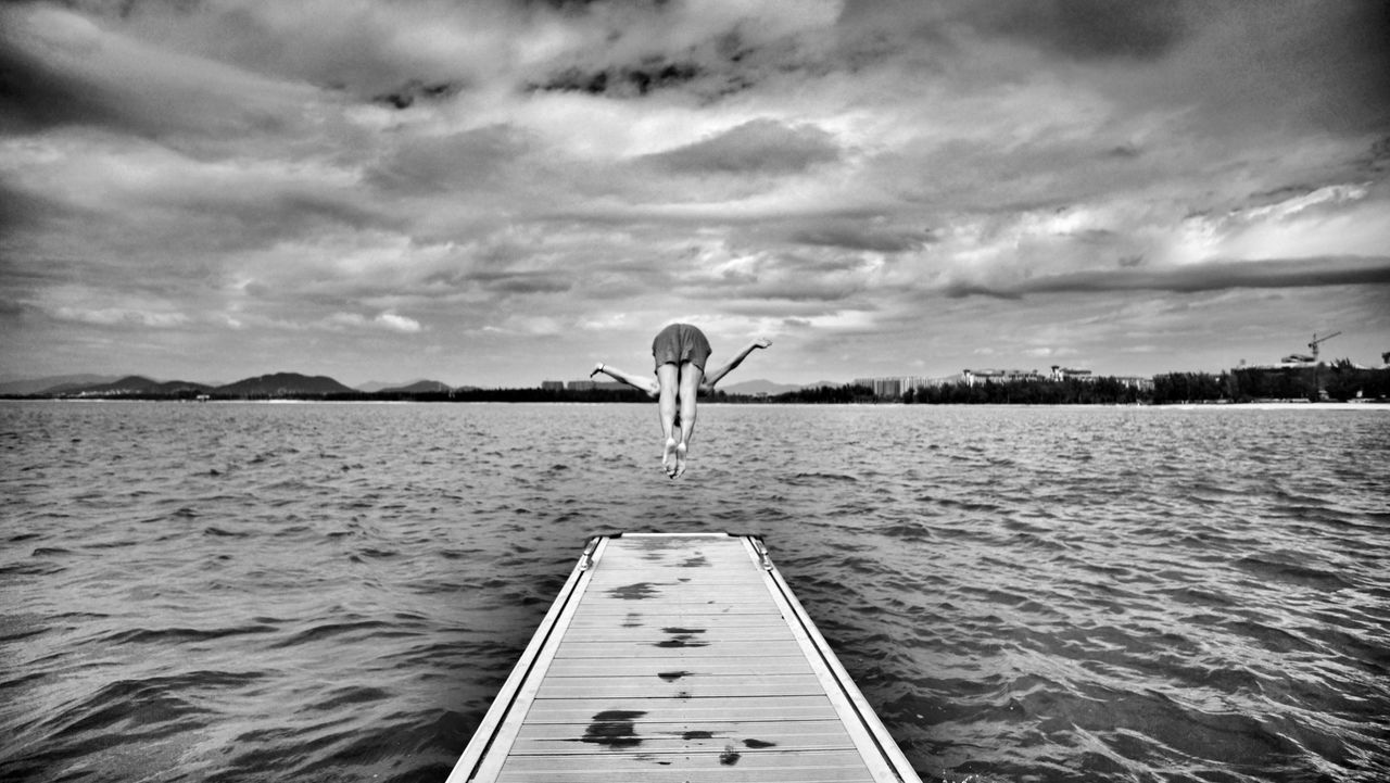 water, sky, cloud - sky, rippled, cloud, tranquility, pier, tranquil scene, cloudy, transportation, nature, scenics, lake, nautical vessel, waterfront, beauty in nature, day, cropped, one person, outdoors