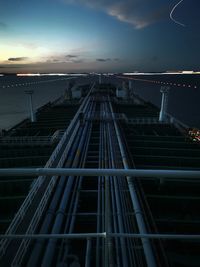 Low angle view of a vessel navigatinh against sky at night
