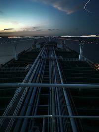 Low angle view of a vessel navigatinh against sky at night