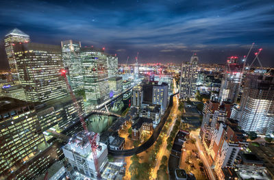 High angle view of city lit up at night