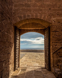 View of arched wall through arch