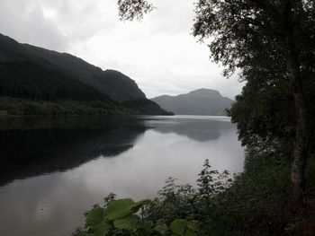 Scenic view of lake with mountains in background