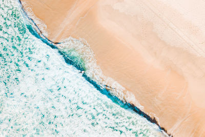 High angle view of waves on beach