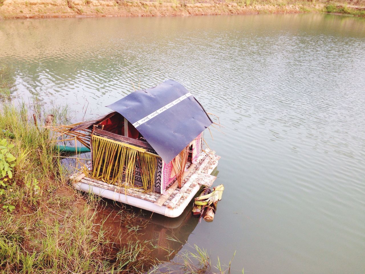 nautical vessel, water, high angle view, transportation, outdoors, lake, nature, no people, day, grass