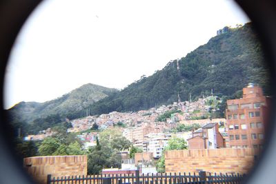 Houses in town against clear sky