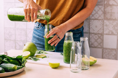 Midsection of man preparing food on table