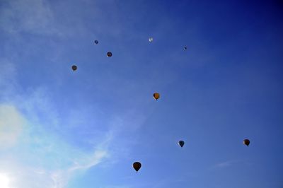 Low angle view of hot air balloons against sky