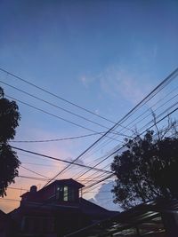 Low angle view of silhouette buildings against sky during sunset