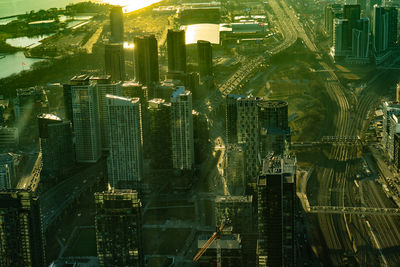 High angle view of city lit up at night