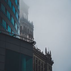 Low angle view of buildings in city against sky