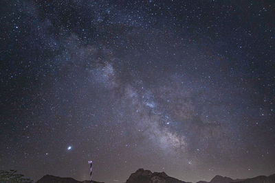 Scenic view of star field against sky at night