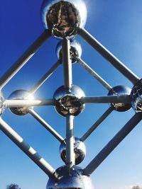 Low angle view of lamp against blue sky