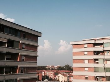 Houses against sky in city