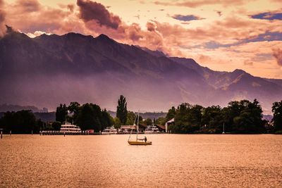 Scenic view of mountains against sky at sunset