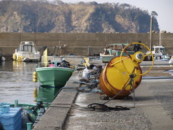 Boats moored at harbor