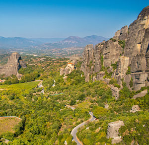 View of landscape with mountain range in background