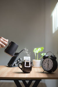 Woman using mobile phone on table