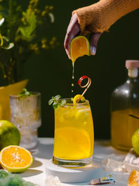 Close-up of orange juice on table