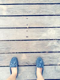 Low section view of person standing on pier