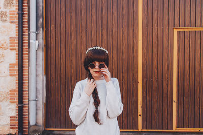 Portrait of man wearing sunglasses standing outdoors