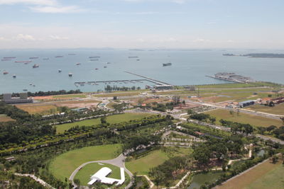 High angle view of trees by sea against sky