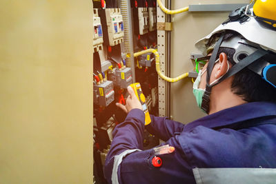 Man repairing electric meter