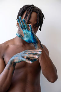 Artistic black man with painted hands