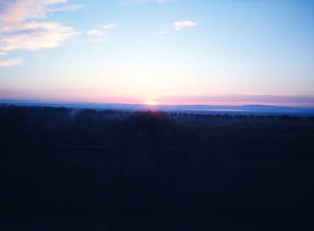 Scenic view of silhouette landscape against sky during sunset