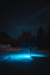 Scenic view of mountains against sky at night