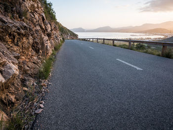 Road amidst landscape against sky