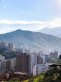 High angle view of buildings in city against sky