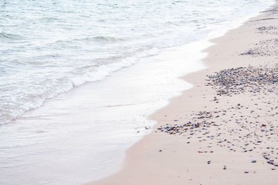 High angle view of waves rushing towards shore