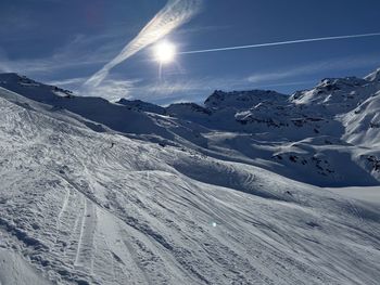 Scenic view of snowcapped mountains against sky