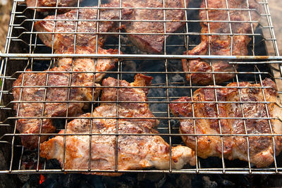 Close-up of meat on barbecue grill