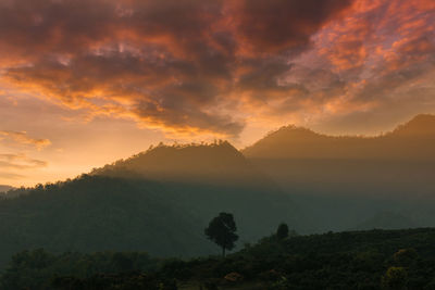 Scenic view of mountains against dramatic sky