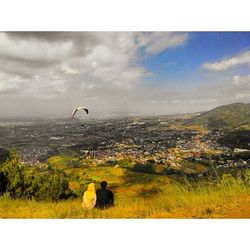 Scenic view of landscape against cloudy sky