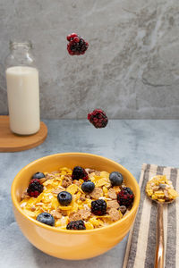 Various fruits in bowl on table