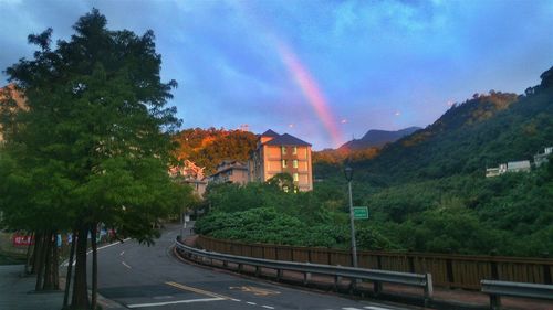 Panoramic view of rainbow over buildings in city